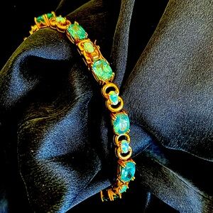 8 inch gold plated opal and Pluto has bracelet